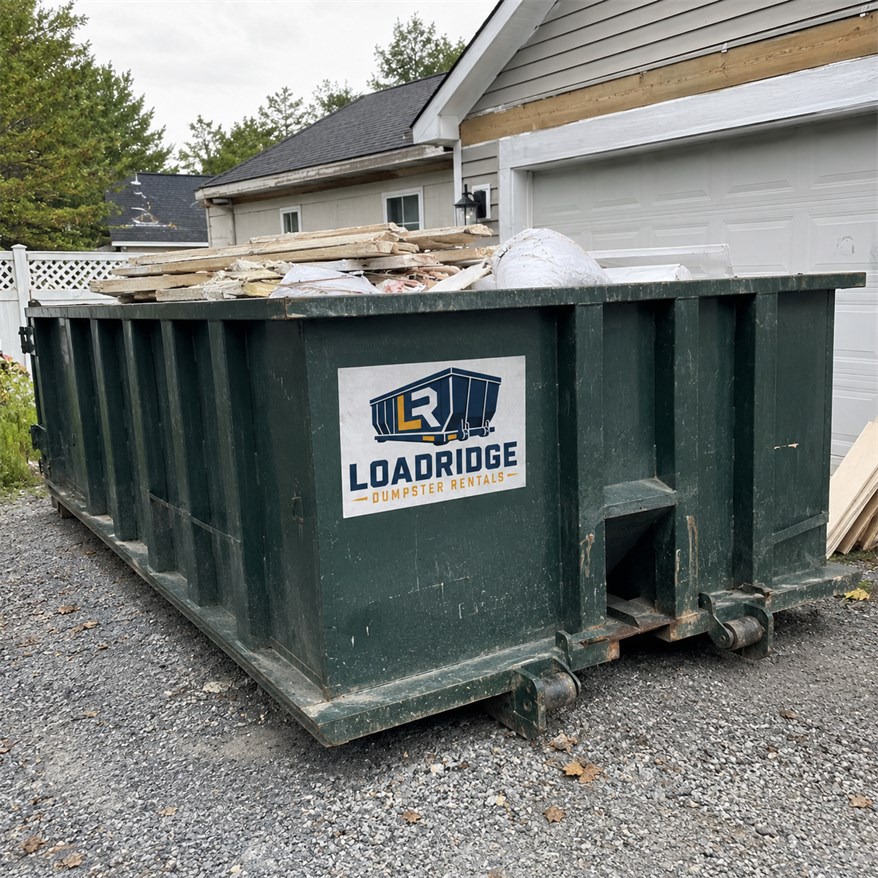 Loadridge dumpster filled with home cleanout and renovation debris